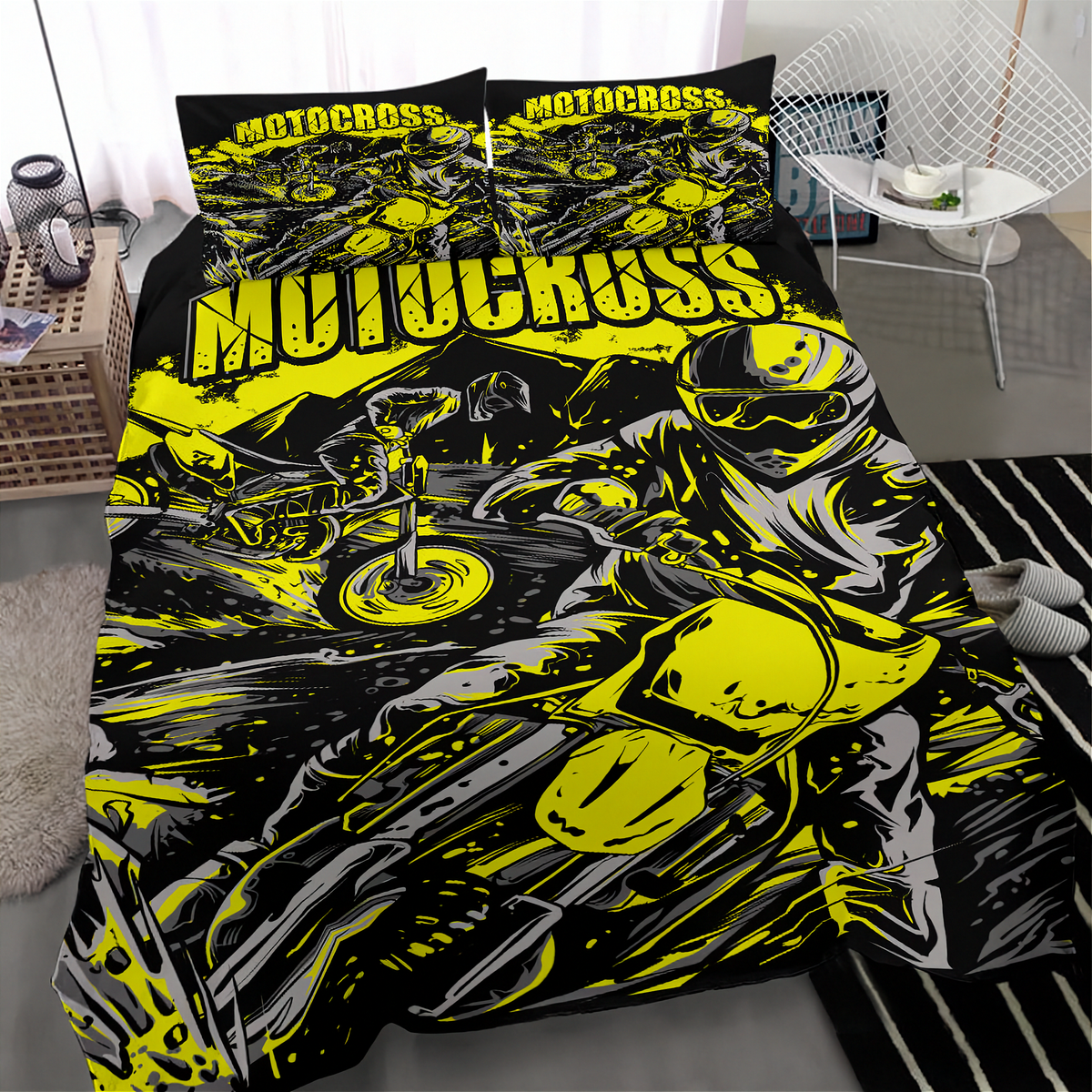 A motocross-themed bedding set featuring a duvet cover and two pillowcases with a bold graphic print of a rider on a motorcycle in neon yellow, black, and gray, shown on a bed in a modern bedroom setting.
