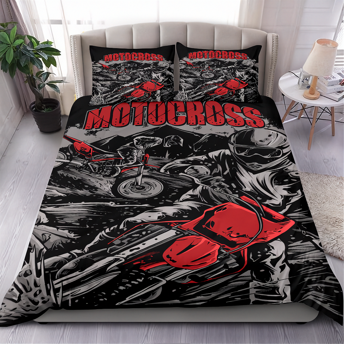A motocross-themed bedding set featuring a duvet cover and two matching pillowcases with a bold red, black, and white graphic print of a motorcycle racer, styled on a bed in a modern bedroom setting.