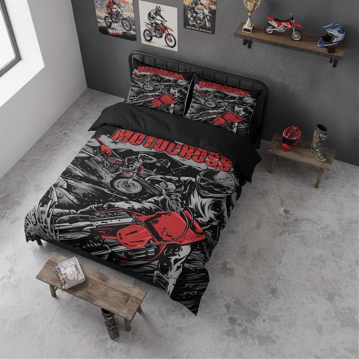 A motocross-themed bedding set featuring a duvet cover and two matching pillowcases with a black, gray, and red graphic print of a motorcycle racer and the word 'MOTOCROSS' in red, styled on a bed in a modern gray room.