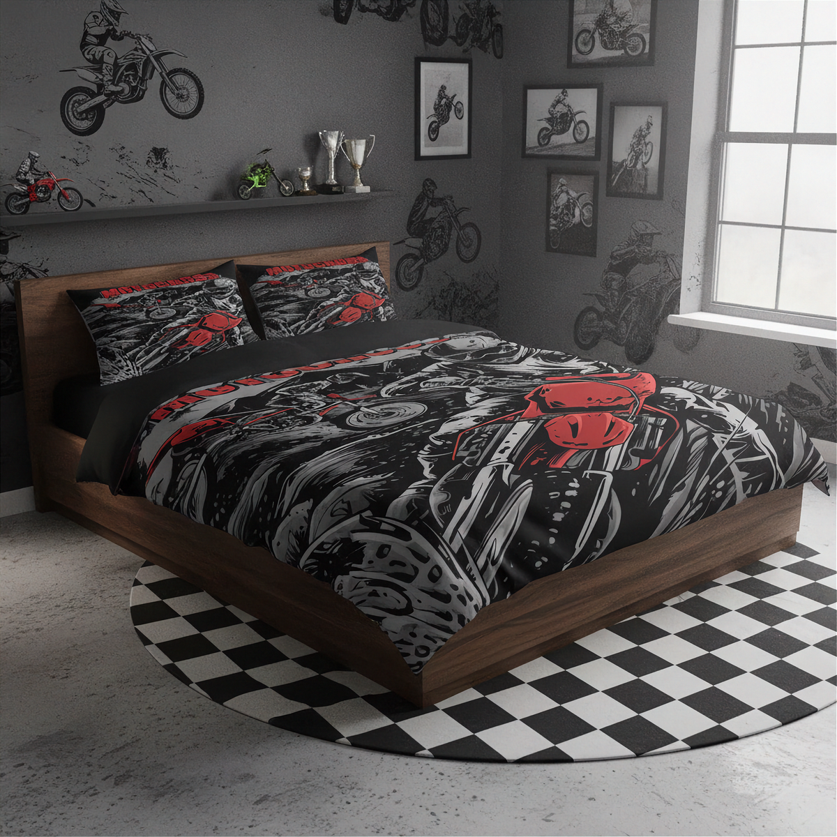 A bed dressed in a black, gray, and red motorcycle-themed bedding set, placed in a dark gray bedroom with motorcycle wall decals, framed pictures, and a black-and-white checkered rug.
