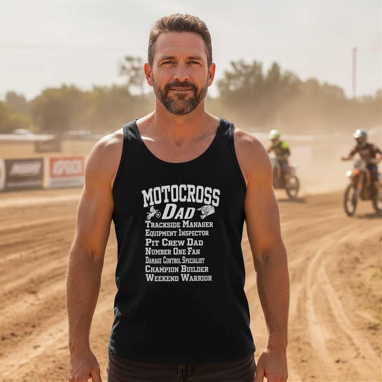 Man wearing a black tank top with 'Motocross Dad' text on a dirt track background