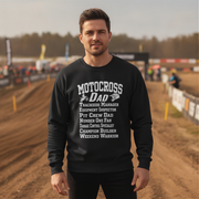Man wearing a black sweatshirt with 'Motocross Dad' text on a dirt track background