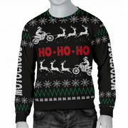 A black Christmas crewneck sweater displayed on a gray mannequin torso. The sweater features a festive holiday pattern with white snowflakes, green zig-zag stripes, white reindeer and Santa Claus on motorcycles, and 'HO - HO - HO' printed in red across the chest.