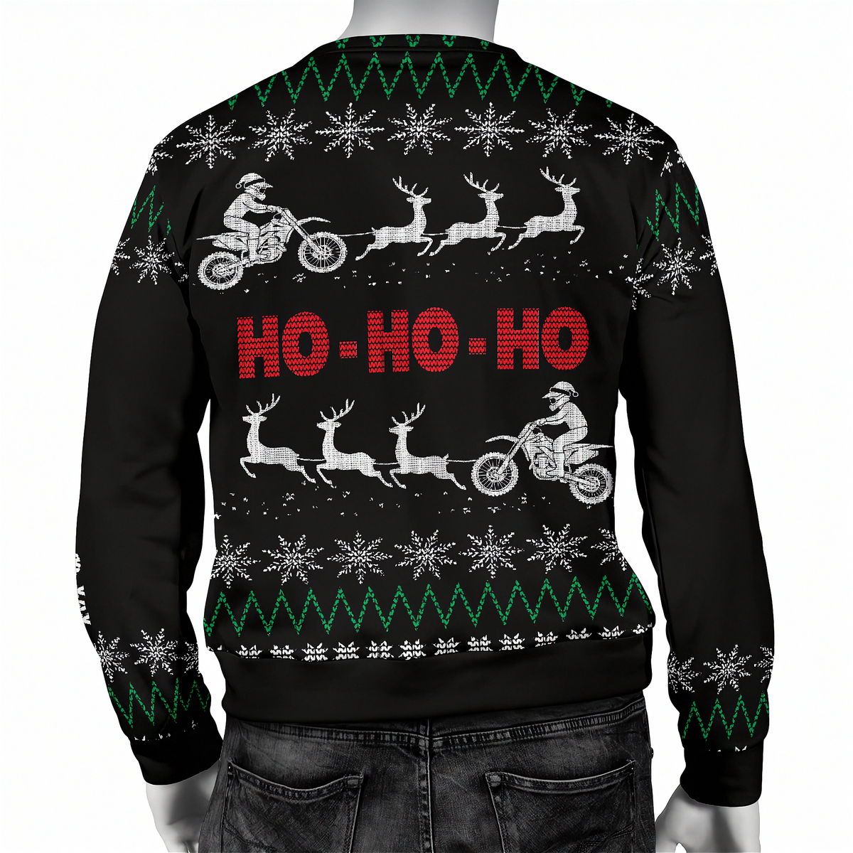 A black Christmas sweater with a festive holiday pattern, featuring white snowflakes, green zig-zag stripes, white sledding reindeer, and red 'HO-HO-HO' text on the back. The sweater is shown on a mannequin from the rear view.