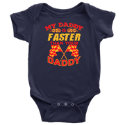 Navy blue baby onesie with colorful text and racing flags on a white background