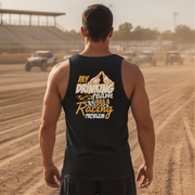 Man wearing a black tank top with a humorous text design on a dirt track.