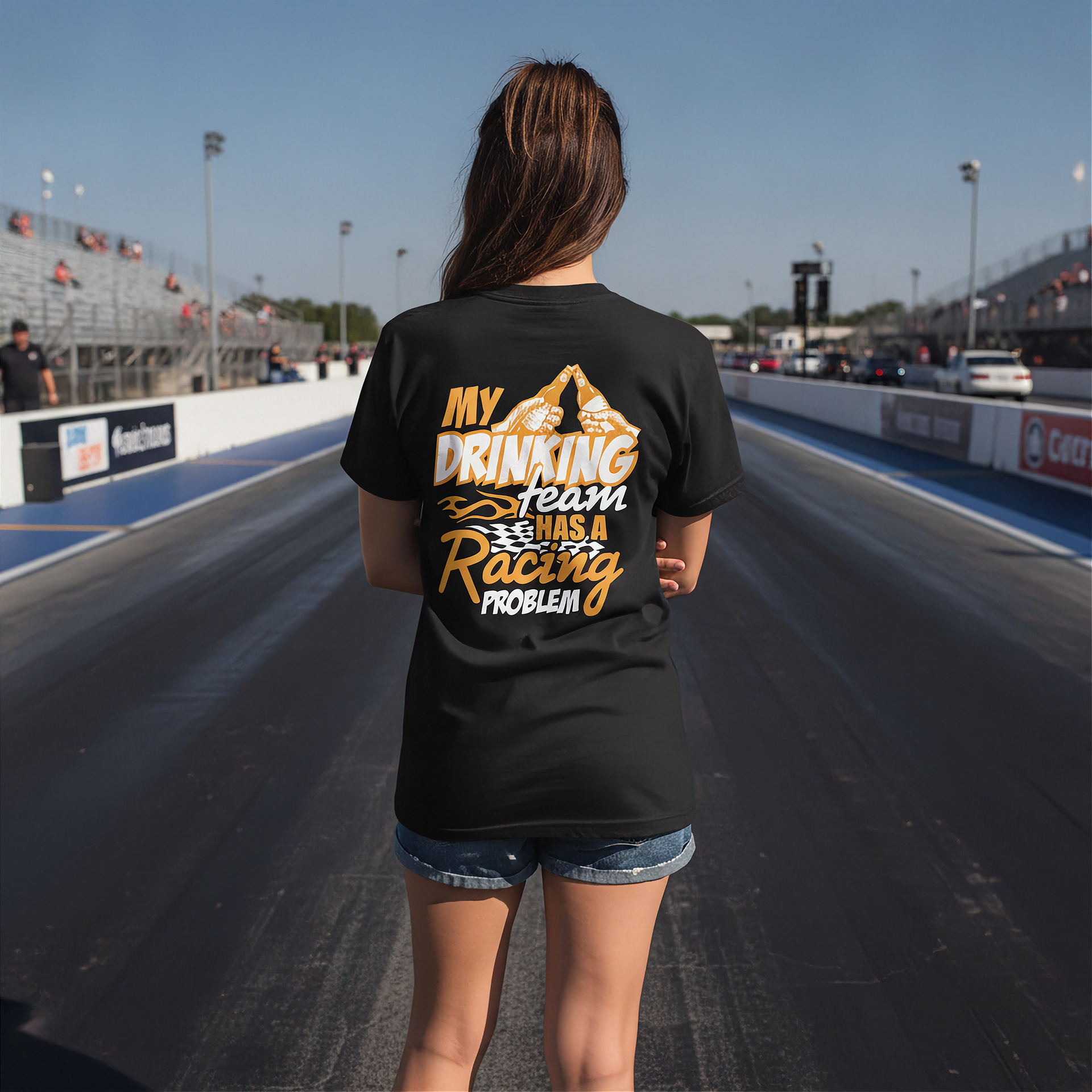 Woman wearing a black t-shirt with humorous text on a race track