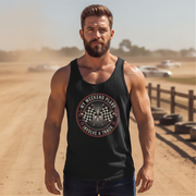 Man wearing a black tank top with a graphic design in an outdoor setting