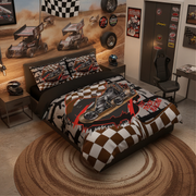 A racing-themed bedding set displayed on a bed in a styled bedroom. The set includes a duvet cover and two matching pillowcases featuring a graphic of a race car over a checkered flag pattern, with a brown and white camouflage background.