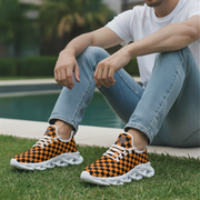 Woman wearing orange and black checkered shoes with white soles, sitting by a pool.