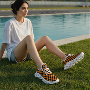 Woman sitting by a pool wearing checkered sneakers