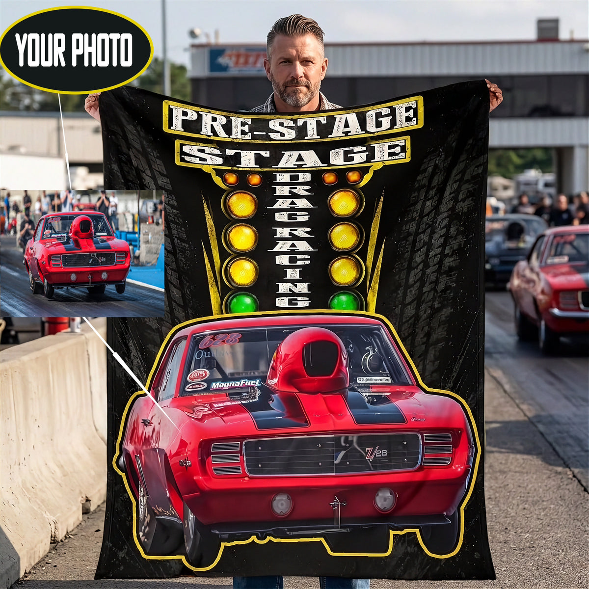 A man stands on a racetrack holding a large black custom-printed blanket or poster featuring a red muscle car, racing lights, and the words 'PRE-STAGE DRAG RACING.' A circular inset shows a red race car on a track, and a 'YOUR PHOTO' badge appears in the top left, indicating a customizable print product.