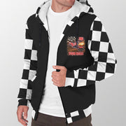 Man modeling a black motocross sherpa jacket with personalized chest artwork, checkered sleeves, and white sherpa lining.