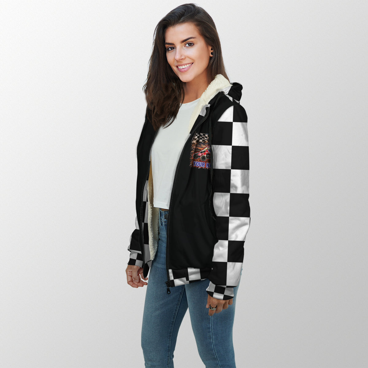 Woman modeling a personalized midget racing sherpa jacket with black-and-white checkered sleeves and car artwork on the chest.