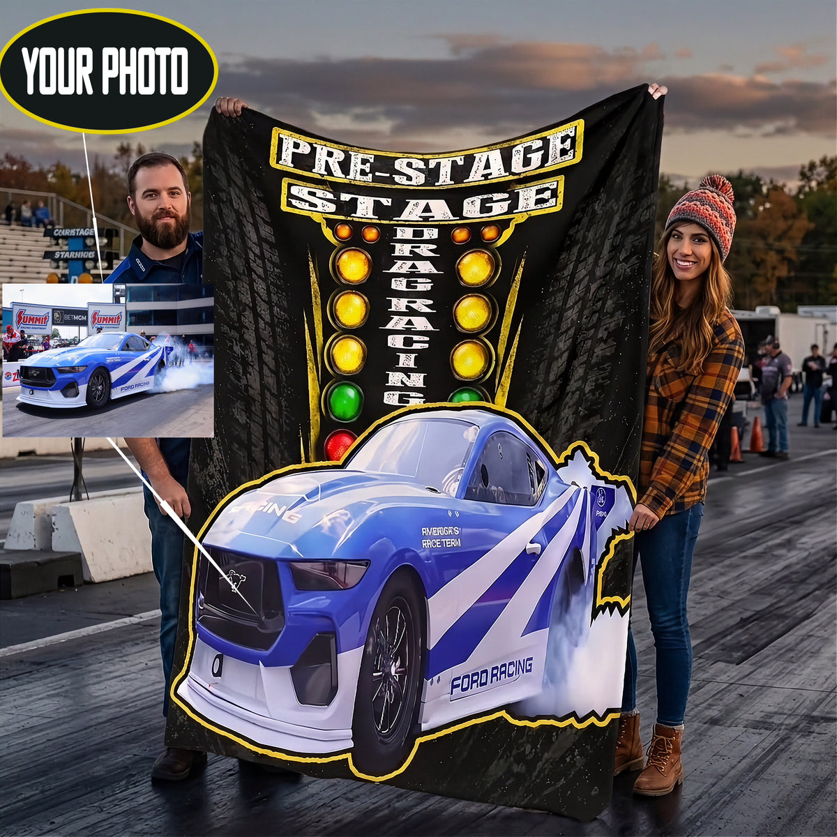 A couple stands on a drag racing track holding a large custom-printed black banner featuring tire graphics, the words 'PRE-STAGE DRAG RACING,' and a blue Ford racing car illustration. A small inset photo shows a man in a striped shirt, and a circular badge at top left says 'YOUR PHOTO,' suggesting a customizable print service.