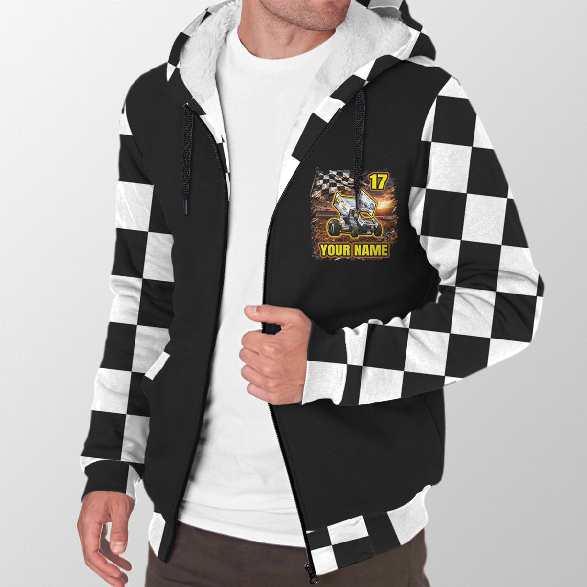 Man modeling the front of a black sprint car sherpa jacket with checkered sleeves and personalized name and number graphic.