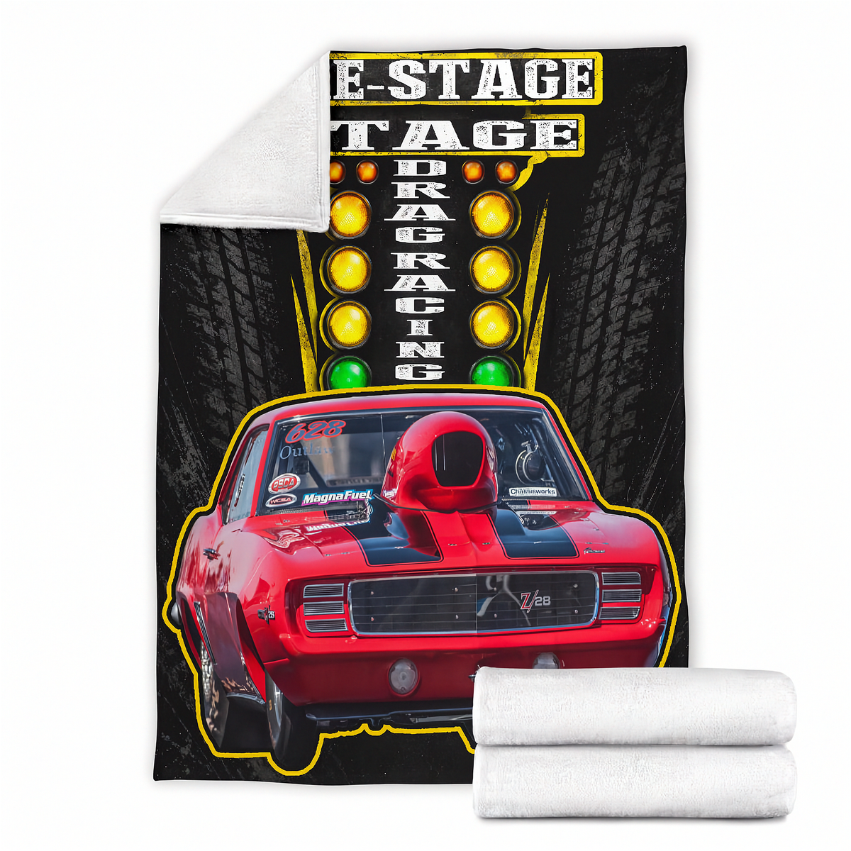 A fleece throw blanket featuring a vintage red drag racing car and 'E-Stage Drag Racing' graphic on a black tire-patterned background, shown with a white sherpa reverse side and two rolled white fleece ends on a white background.