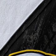 A close-up detail shot of a product showing a diagonal split between a textured white surface and a black distressed surface with a yellow curved accent line at the bottom.