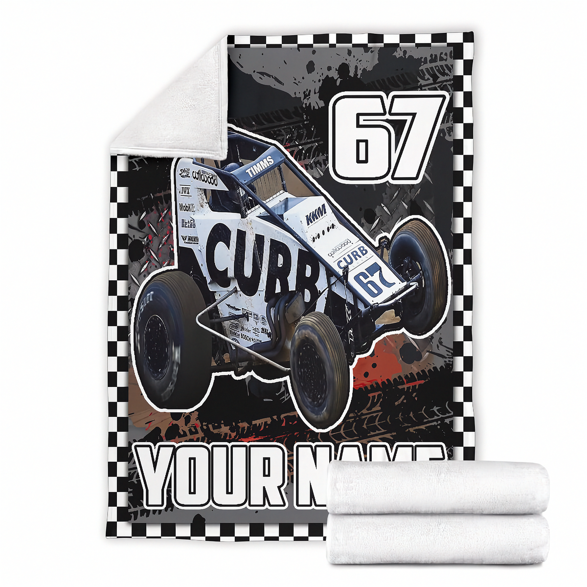 A custom printed fleece blanket featuring a white and black Non Wing sprint car with the number 67, a checkered border, and 'YOUR NAME' printed at the bottom. A rolled-up white fleece blanket is shown in the foreground, set against a plain white background.