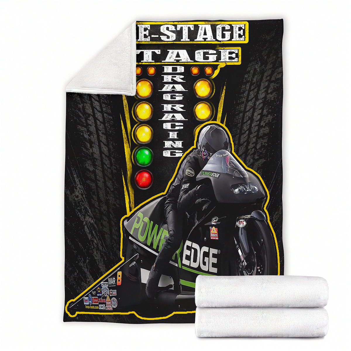 A fleece blanket featuring a drag racing graphic with a motorcycle racer, tire tread background, and illuminated speed light columns, shown with a white sherpa reverse side and two folded white ends on a white background.
