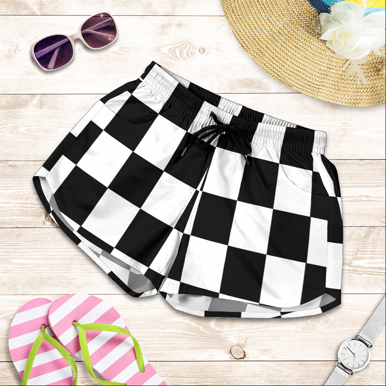 Premium women's athletic shorts featuring a bold checkered racing flag pattern, designed with an elastic drawstring waistband and functional side pockets.