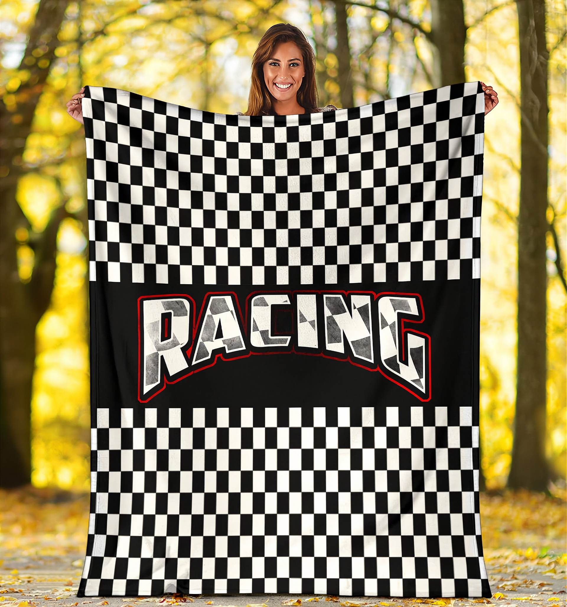 Woman holding a checkered racing flag with 'Racing' text in a forest setting