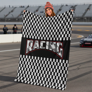Man holding a checkered racing flag on a race track