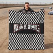 Man holding a checkered racing flag on a race track