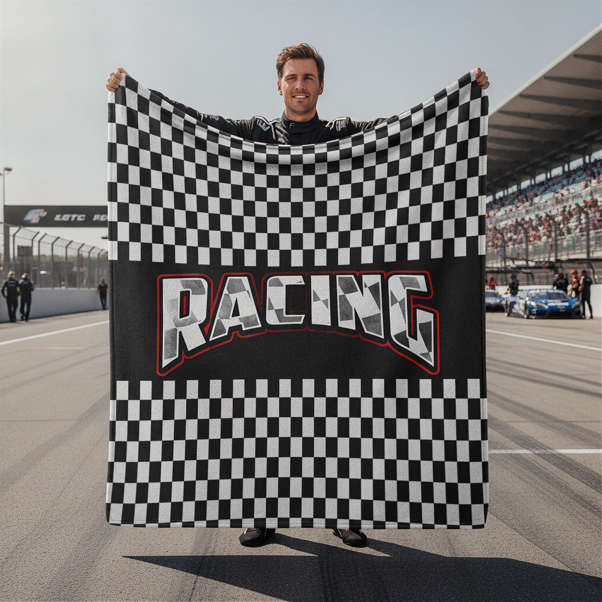 Person holding a checkered flag with 'Racing' text on a race track