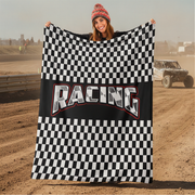 Woman holding a checkered racing flag with 'Racing' text on a dirt track background