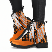 Woman sitting wearing a checkered pattern orange boots