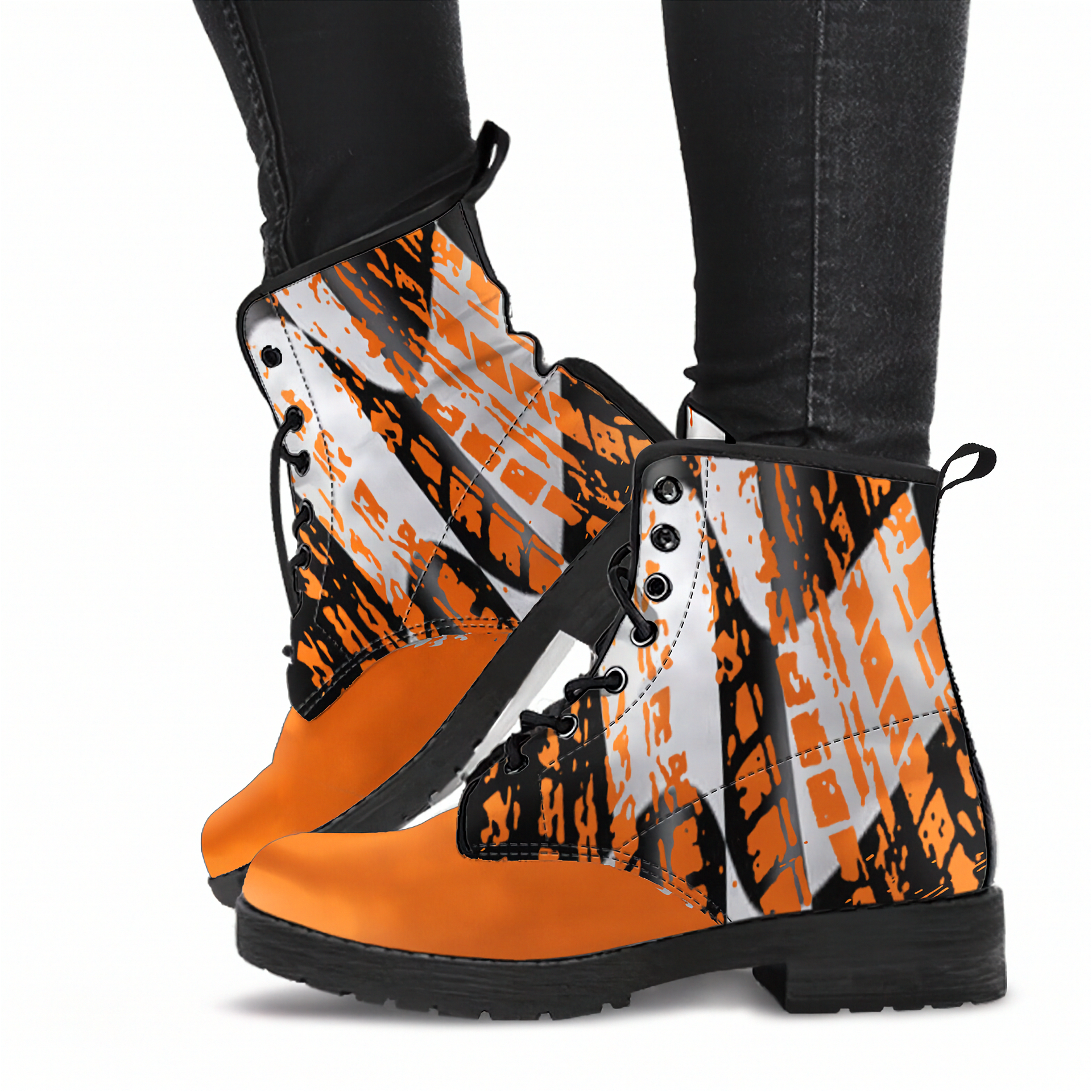 Woman sitting wearing a checkered pattern orange boots