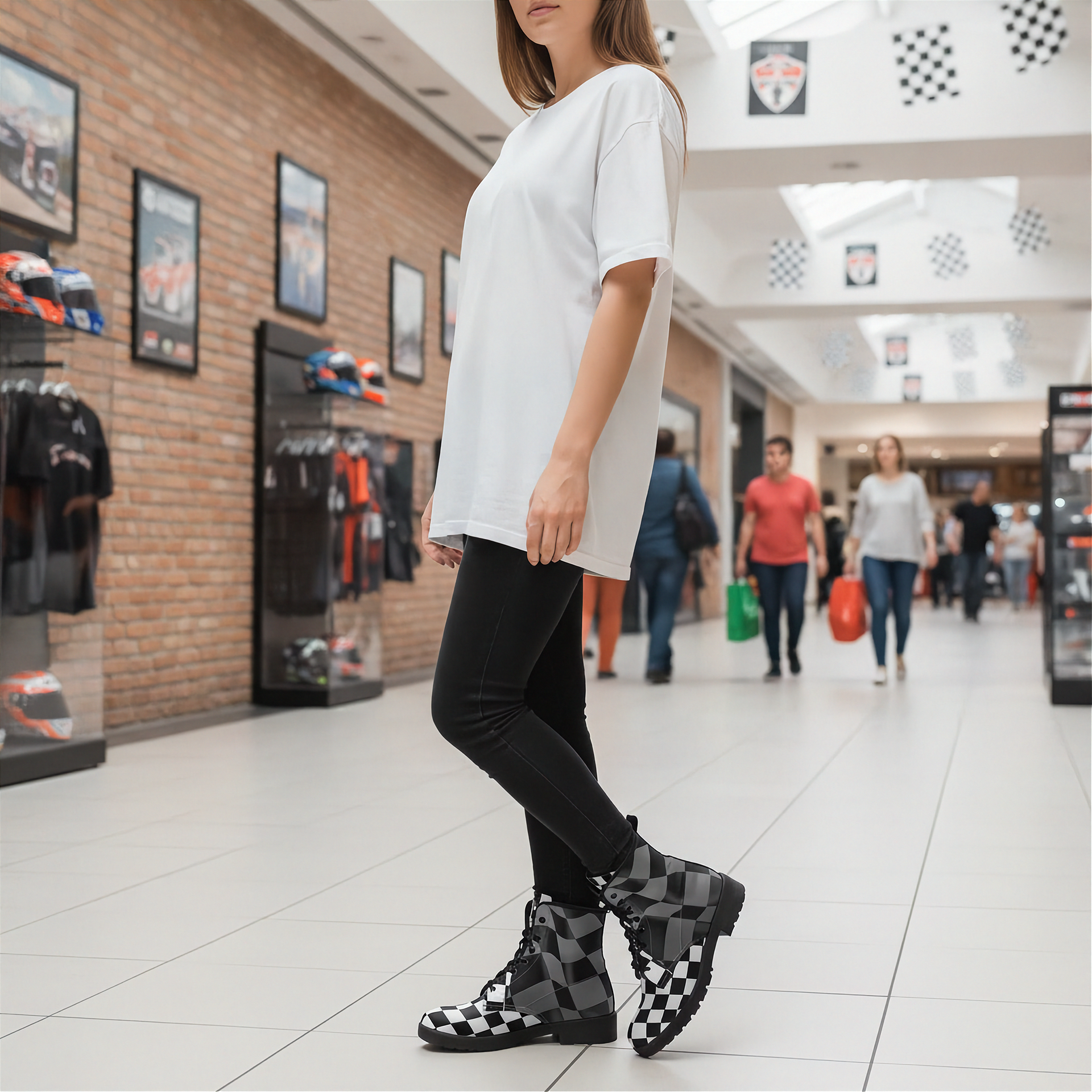 Person wearing a white shirt and checkered boots in a shopping mall.