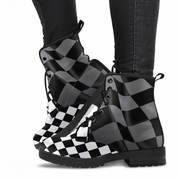 Black and white checkered boots worn with dark jeans on a white background