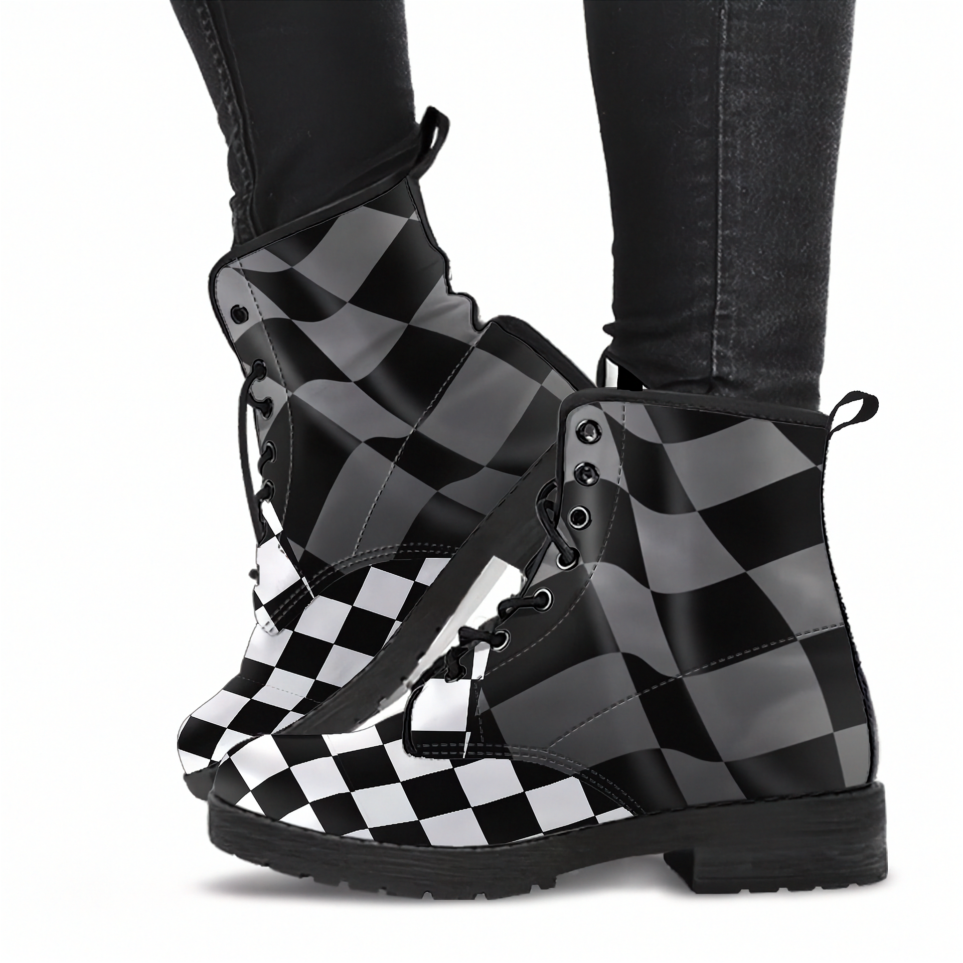 Black and white checkered boots worn with dark jeans on a white background