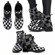 Black lace-up boots with intricate patterns on a white background