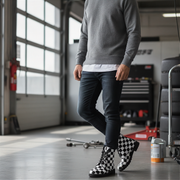 Person wearing checkered boots in a garage setting