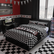 A racing-themed bedroom set featuring a black and white checkered duvet cover and matching pillowcases on a black bed frame, styled in a modern race track themed room with a checkered floor, desk, and wall decals.
