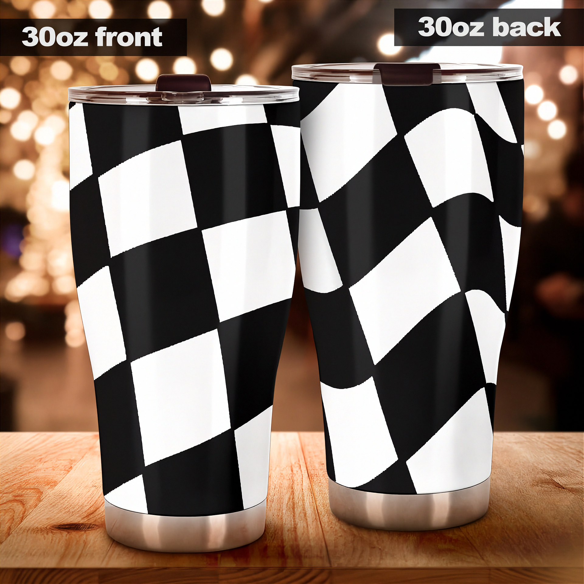 Two stainless steel tumblers with a black and white checkered pattern on a wooden surface.