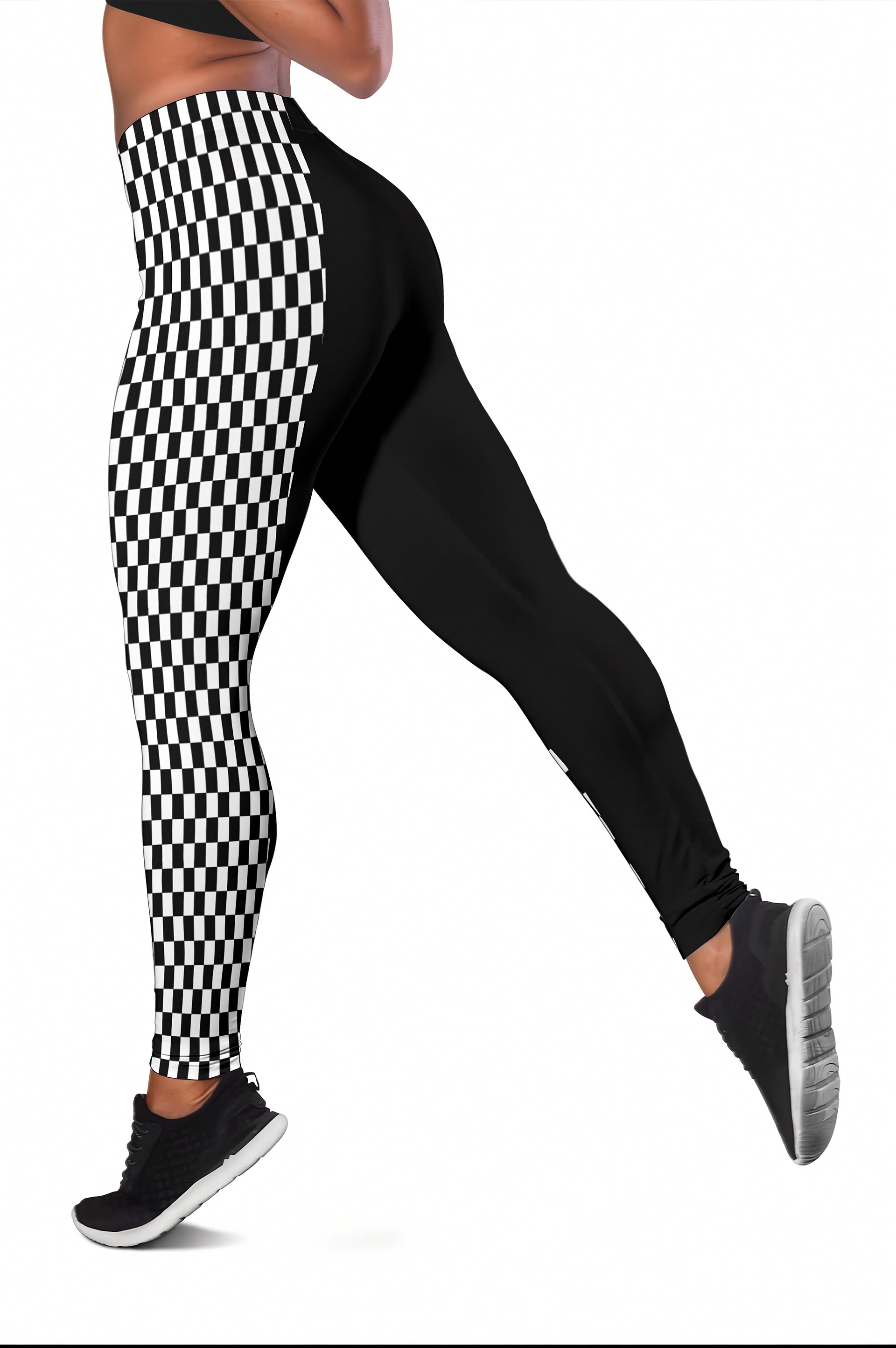 Black and white checkered pattern leggings worn by a model, paired with black athletic shoes, shown from the waist down on a white background.