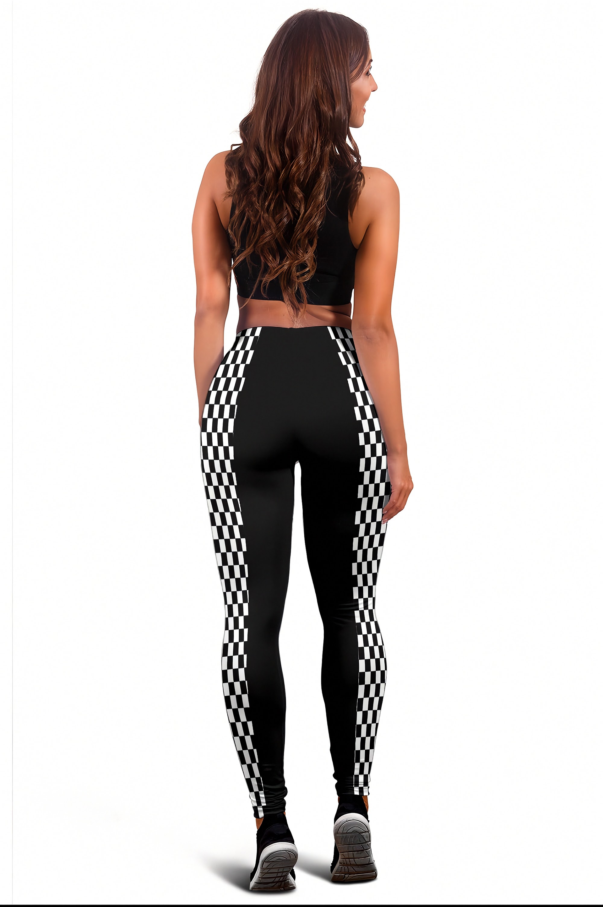 A woman shown from the back wearing black high-waisted leggings with a black and white checkered pattern down the sides, paired with a black sports bra, against a plain white background.