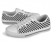 White low top shoes with black and white checkered pattern on a white background
