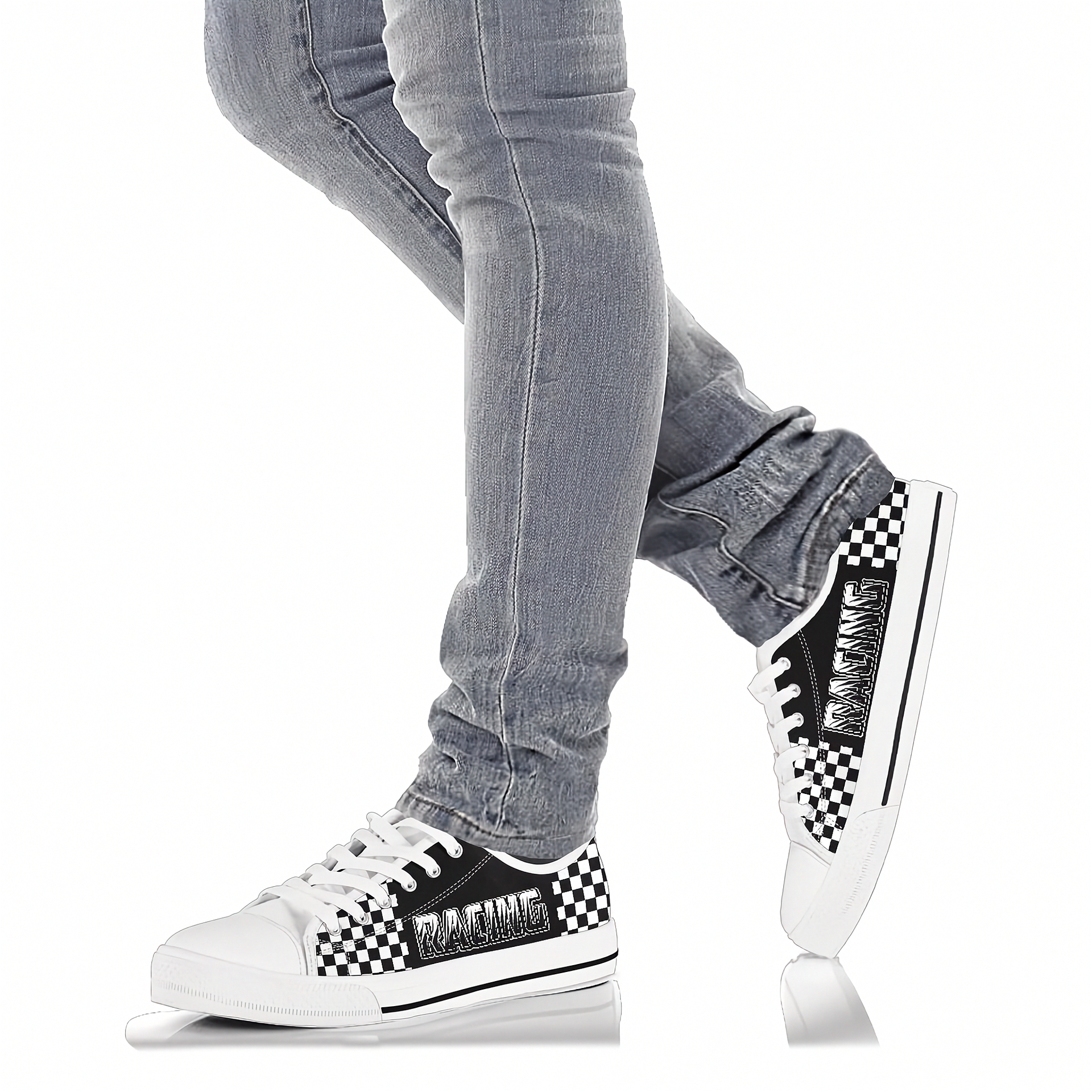 White sneakers with black checkered pattern worn with gray jeans on a white background