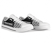 White sneakers with black and white checkered pattern and 'Racing' text on a white background