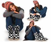 Woman wearing checkered boots and a colorful knit hat on a white background