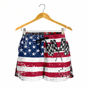 American flag patterned shorts on a hanger with a white background