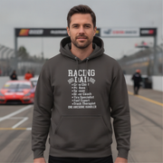 Man wearing a gray hoodie with racing-themed text on a race track background