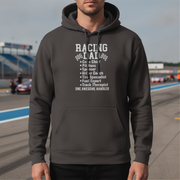 Person wearing a black hoodie with 'Racing Dad' text on a race track background