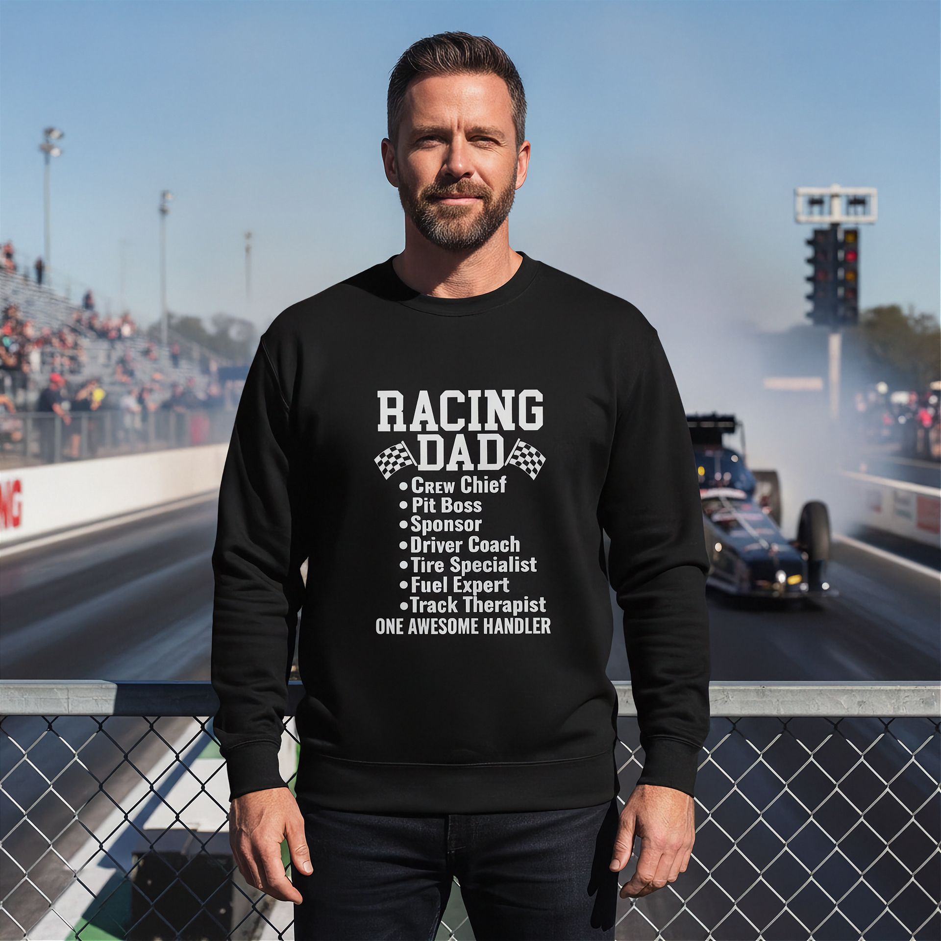 Man wearing a black sweatshirt with 'Racing Dad' text at a race track.