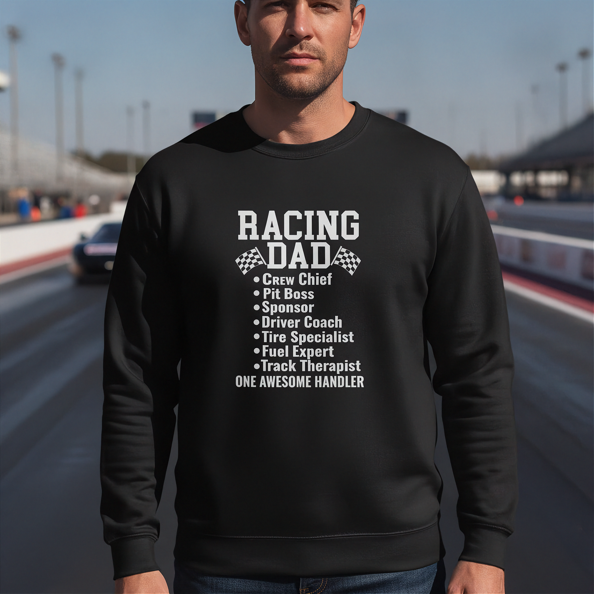 Man wearing a black sweatshirt with 'Racing Dad' text on a race track background
